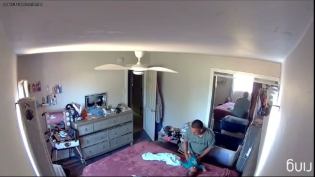 Baby keeps Dad on his toes after sudden dive off bed ends in a last-second save