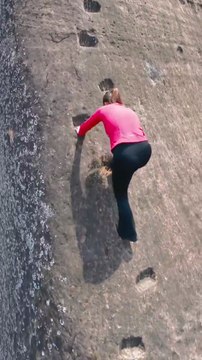 amazing she's climbing top montain