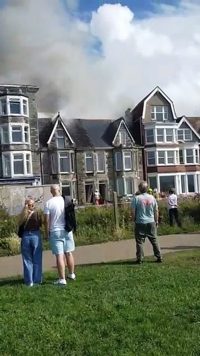 Crowds gathered as the fire took hold at the derelict property at Narrowcliff