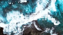 drone aerial blue water waves hawaii rocks