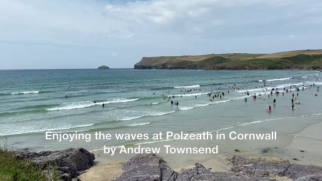 Enjoying the waves at Polzeath in Cornwall by Andrew Townsend
