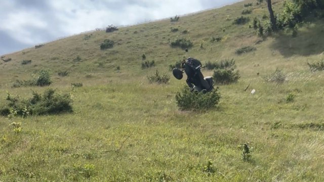 ATV flips and crashes down steep Balkan hill after failed attempt to reach the top