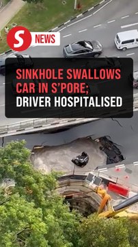 Driver injured after car plunges into sinkhole on Singapore road