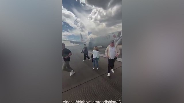 TERROR at Denver Airport: American Airlines Jet on FIRE After Landing