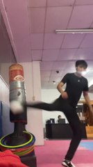 Man Falls After Foot Gets Caught Kicking Bag