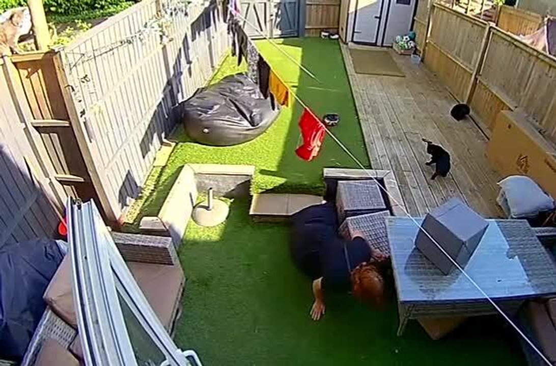 Woman Tumbles Down Garden Step While Hanging Cl...