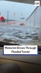 Motorist Drives Through Flooded Tunnel