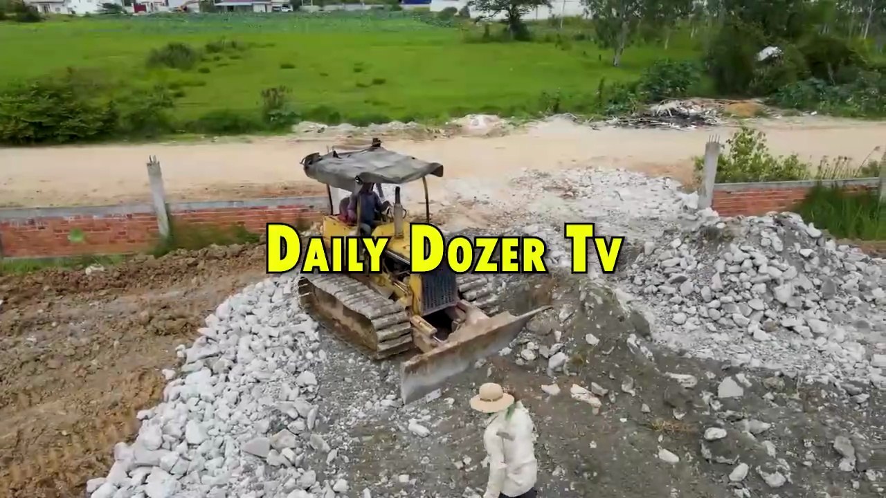 Dump truck starting Unloading Stone and Soil into water open New Project with Bulldozer Komatsu D31P