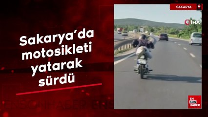 Sakarya’da motosikleti yatarak sürdü