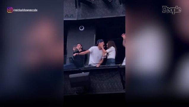 Ashton Kutcher and Mila Kunis Pack on the PDA at Backstreet Boys Concert as They Sing Along to Band's Romantic Hit