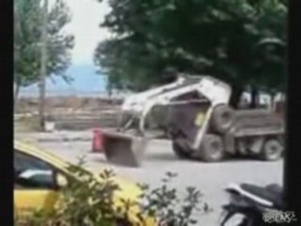 Bobcat Loads Itself onto Truck
