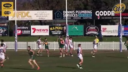 Josh Minogue kicks the first goal of the second half