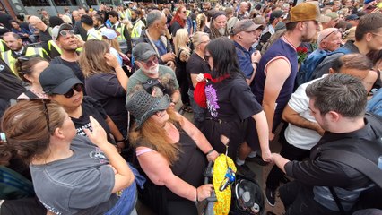 Georgina Wager tries to see at the Ozzy Osbourne Broad Street funeral
