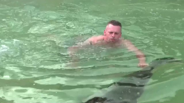 German Man Hugs His 2-Meter Pet Caiman