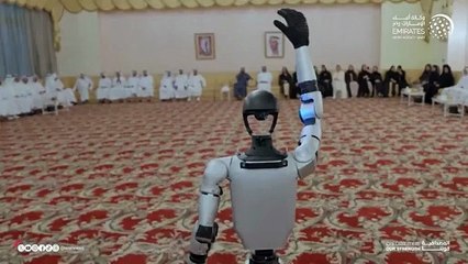 Sheikh Mohammed waves at humanoid robot during live demonstration