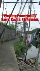 Walking precariously in Kawit, Cavite in the Philippines