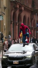 Spider-Man waves to crowd on streets in Glasgow