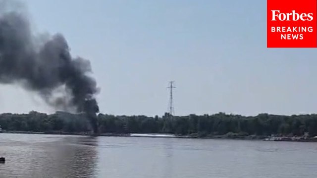 Smoke Can Be Seen After Helicopter Crashes Into Barge On Mississippi River Near Alton, Illinois