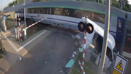 Driver has miracle escape after train obliterates van stuck on level crossing