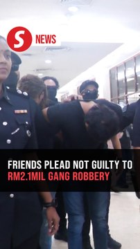 Two men claim trial to robbing Chinese national of RM2.1mil