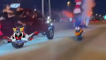 Scooter riding on two wheels with fireworks!