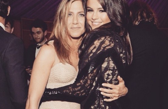 Jennifer Aniston has revealed Selena Gomez has helped her to 'lean into social media'