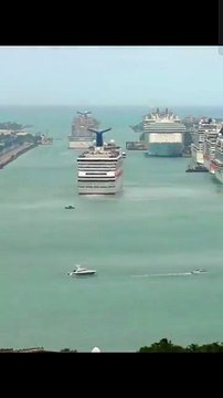 Cruise ships maneuvering out of port