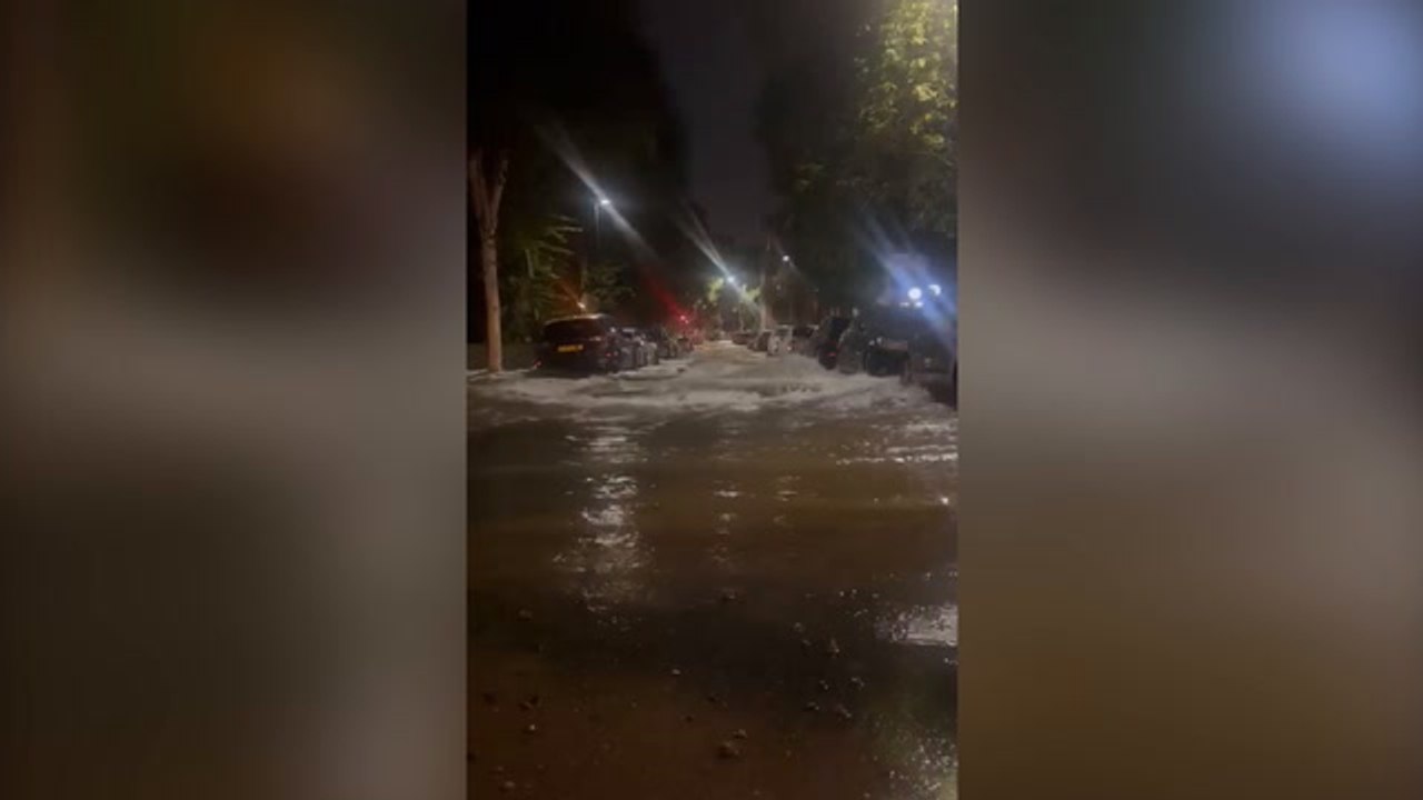 Dozens of residents evacuated after burst water main floods north London streets