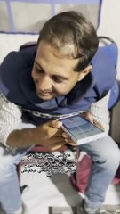 Mohammed Qreiqeh listens to daughter's voice note