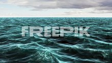 choppy blue ocean under cloudy sky