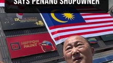 Hardware shopowner says upside-down flag is unintentional and regretful