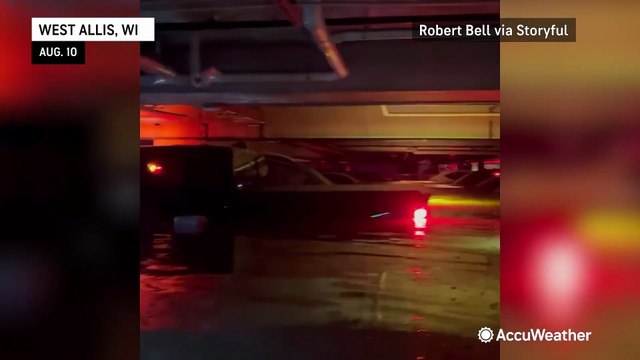 Several feet of water flood parking garage amid heavy rain