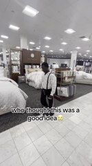 Guy Breaks Glass While Attempting to Jump on Bed in Store