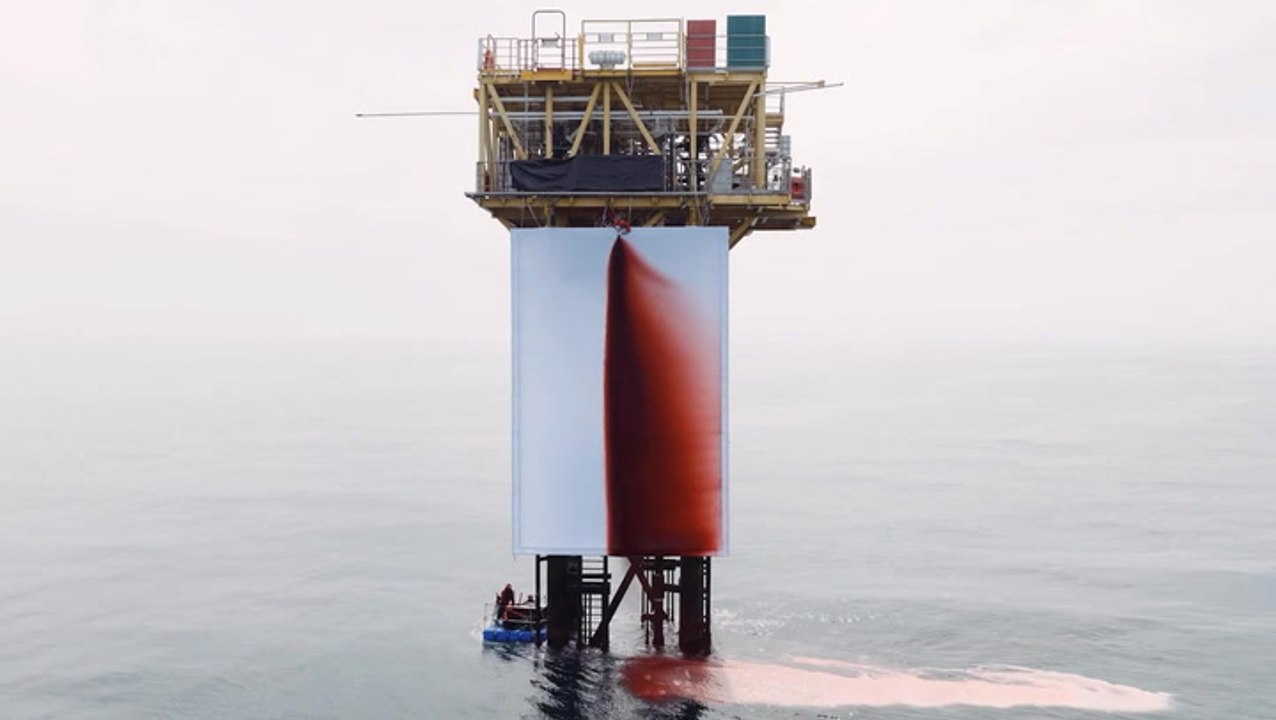 Climate activists spill 1,000 litres of fake blood over North Sea oil rig