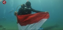 Sebanyak 34 penyelam kibarkan Merah Putih di bawah laut Jayapura
