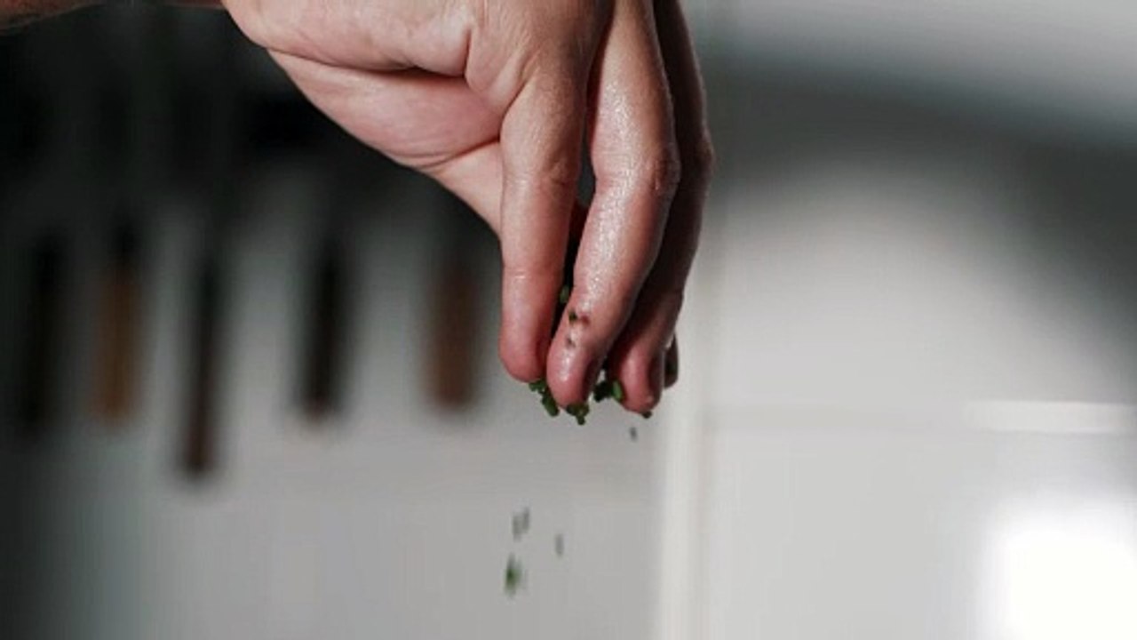 Close-Up Video of Person's Hand Pouring Herbs