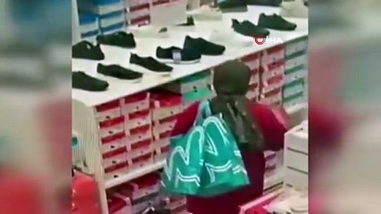 Hırsız kadın kameraya takıldı! AVM’de 26 parça kıyafet çaldı