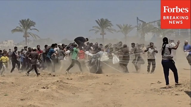 Palestinians Rush To Humanitarian Aid Airdropped Into Gaza