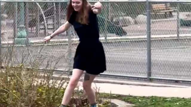 Girl loses balance while roller skating in a park and falls hilariously