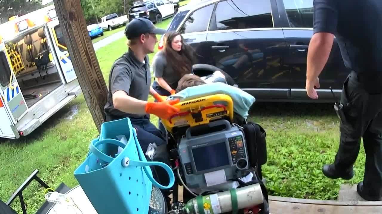 Stretcher Nearly Tips Sideways as Paramedics Assist Unconscious Man Into Ambulance