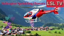“Helicopter Showering Flowers Over the Village | A Heartwarming Scene”