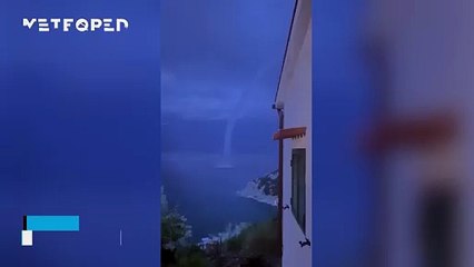 A waterspout descends during a nighttime storm on the island of Elba, Italy! The phenomenon left behind some impressive images