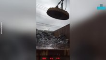 Giant Magnet Sweeps Up Piles of Scrap Metal