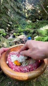 cooking potatoes with meatballs on a tile