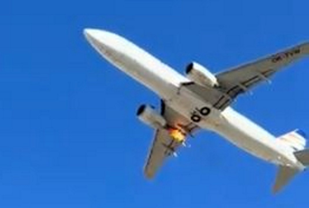Plane's engine shoots out flames