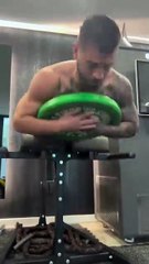 Ilia Topuria putting in the work for more strength and stability with weighted back extensions