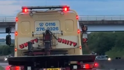 Gentleman with amputated toe films ironic number plate on recovery truck