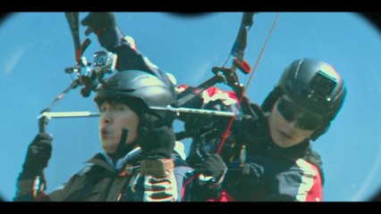 Unmasked - tandem paragliding seen with binoculars
