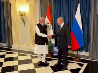 Russia's President Putin and India's Prime Minister Modi pose for photos ahead of meeting.