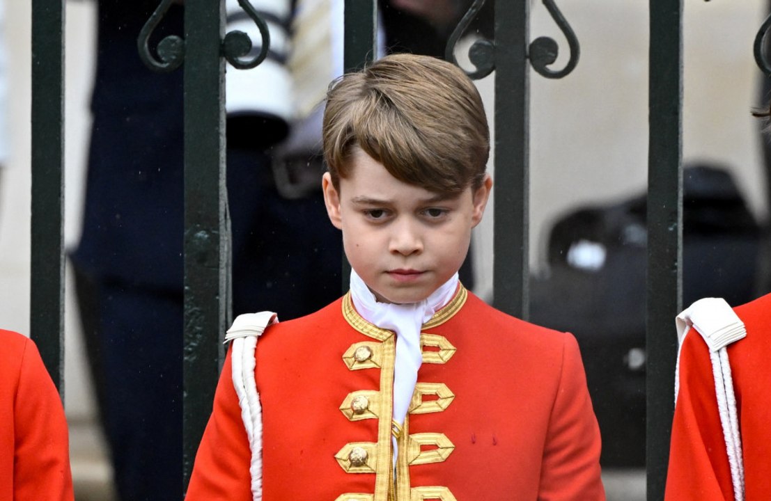 Prince George is 'completely different' in private than he is in public, his father Prince William has revealed